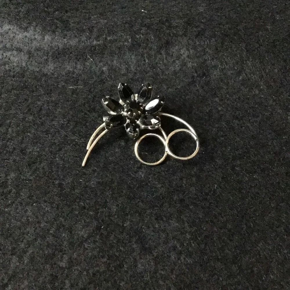 Vintage black rhinestone flower brooch